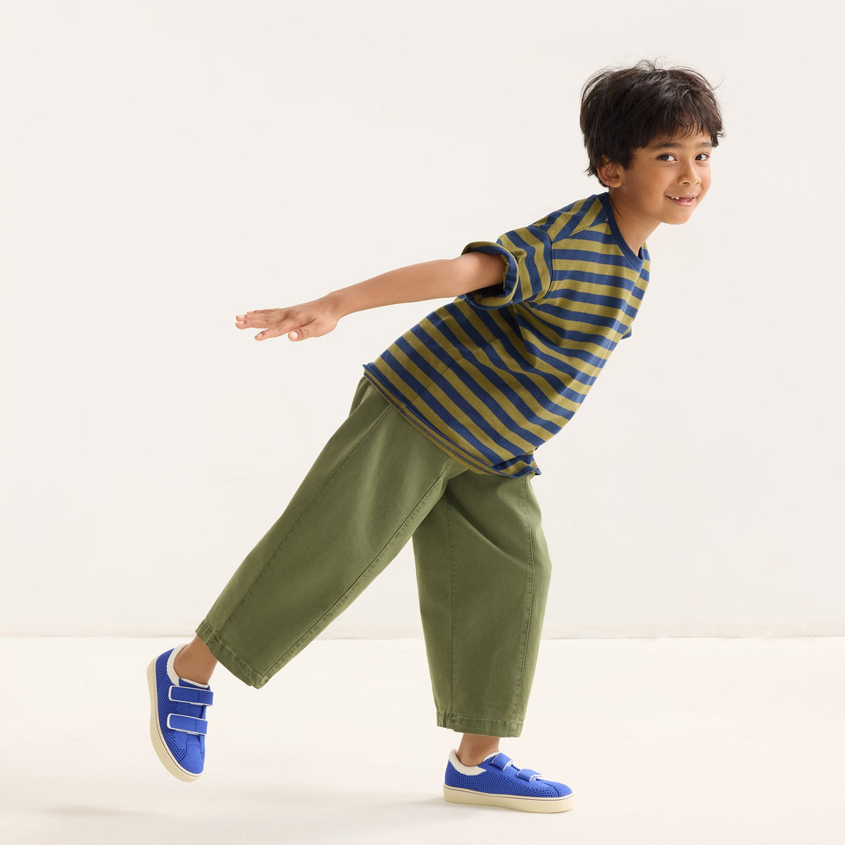 model | Alternate image of a child modeling The Kids Strap Sneaker in Buoy Open-Knit.