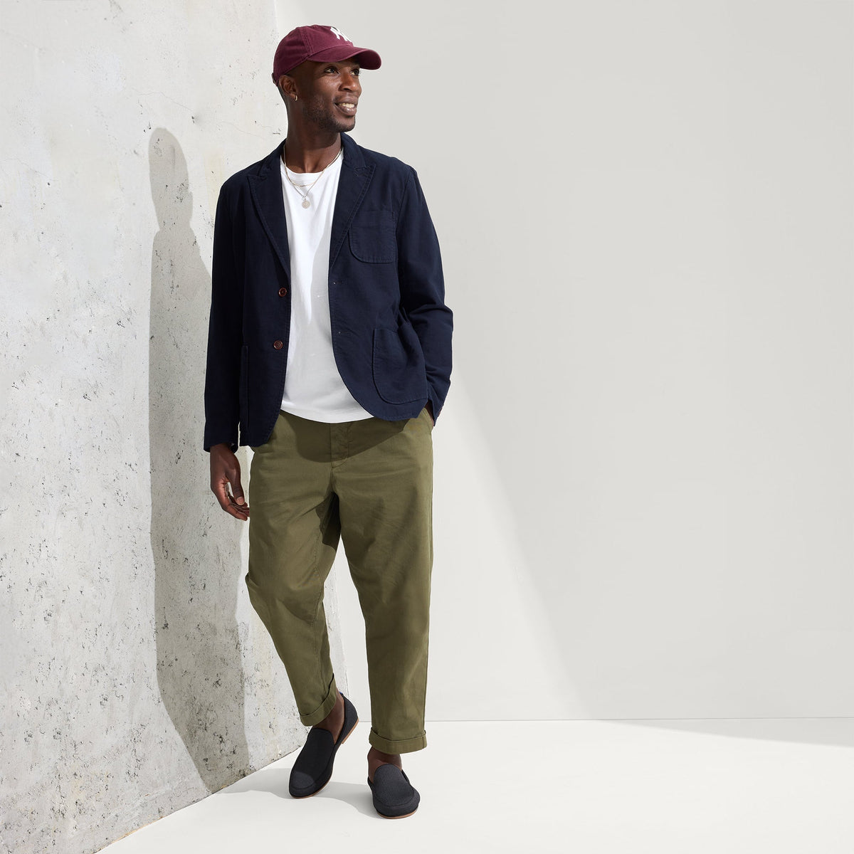 model | Alternate view of a model wearing The Ravello Loafer in Stone Black.
