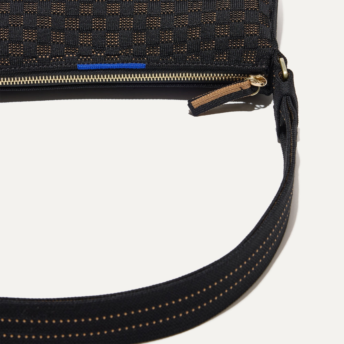 A closeup of The Casual Crossbody in Night Song, focusing on the crossbody strap.