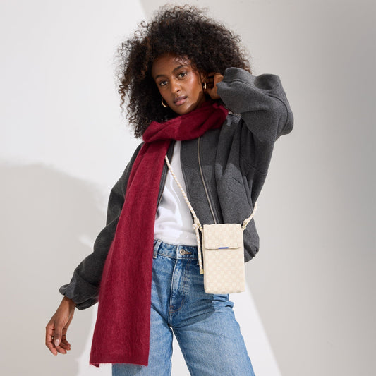 hover | Model wearing The Phone Crossbody in White Sand.