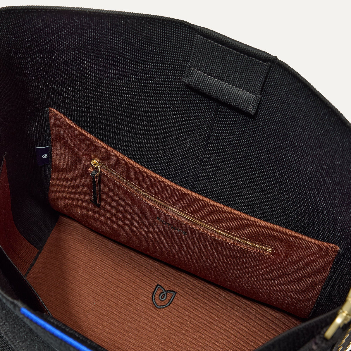 The Bucket Bag in ReVelvet™ Black close up of interior zipper pocket.