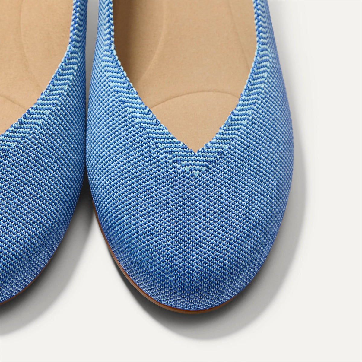 Close up of the toe and vamp of The Daily Flat in Clear Blue.