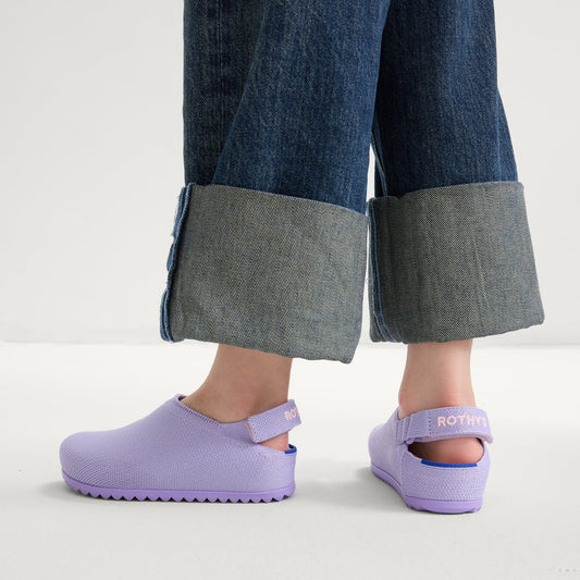 hover | A child wearing The Kids Clog in Soft Orchid.