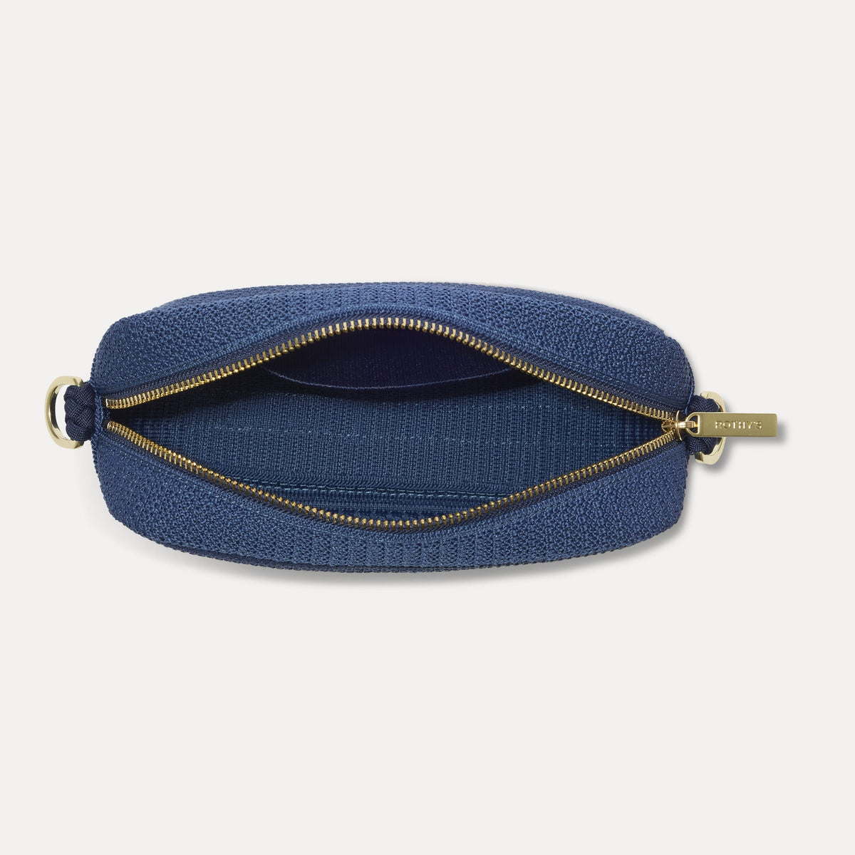 The Crossbody Camera Bag in Lagoon Open-Knit, shown from above, with the interior exposed.