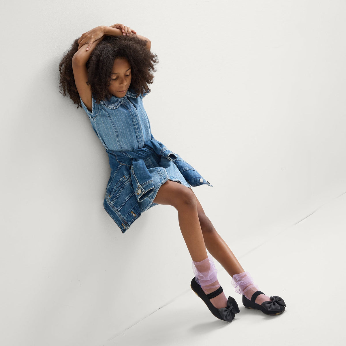 model | An alternate image of a model wearing The Kids Big Bow Mary Jane in Black.