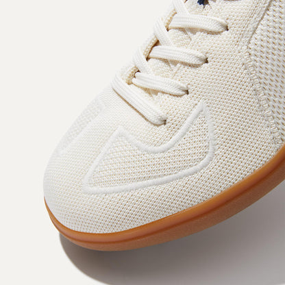 Close up of the toe and stitching details of The RS01 Sneaker in Bone.