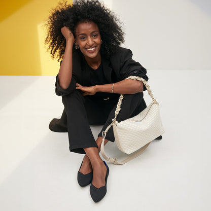 Overlay:: Shown with The Shoulder Strap (sold separately.) | Alt:: The Daily Crossbody in White Sand paired with The Shoulder Strap in White.