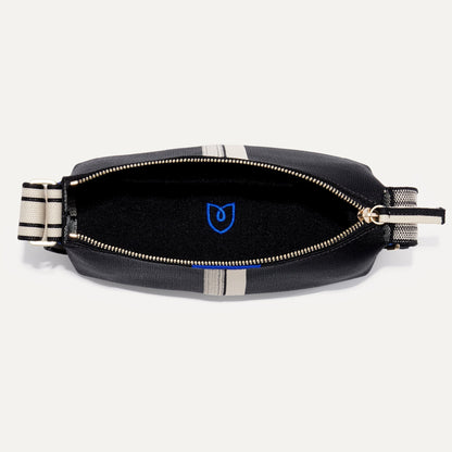 The Casual Crossbody in Black & Ivory Stripe, shown from above, with the interior exposed.
