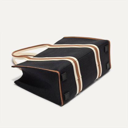 The Classic Tote in Black Coffee, shown from the bottom.