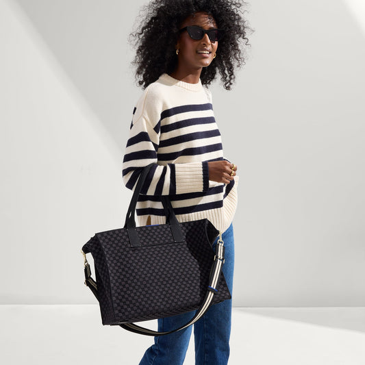 hover | The Crossbody Strap in Black and White Stripe, shown paired with The Classic Tote, worn by a model, shown from the side