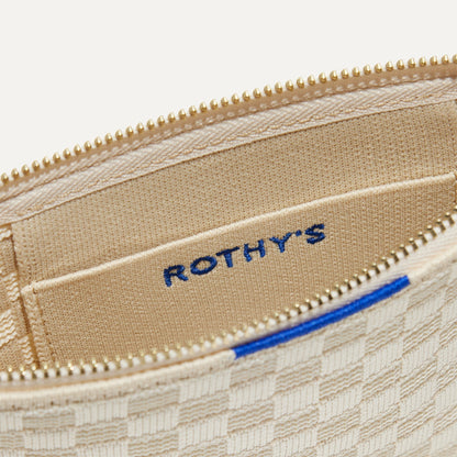 A closeup of The Wallet Wristlet in Vanilla Basketweave, focusing on the inner card slip.