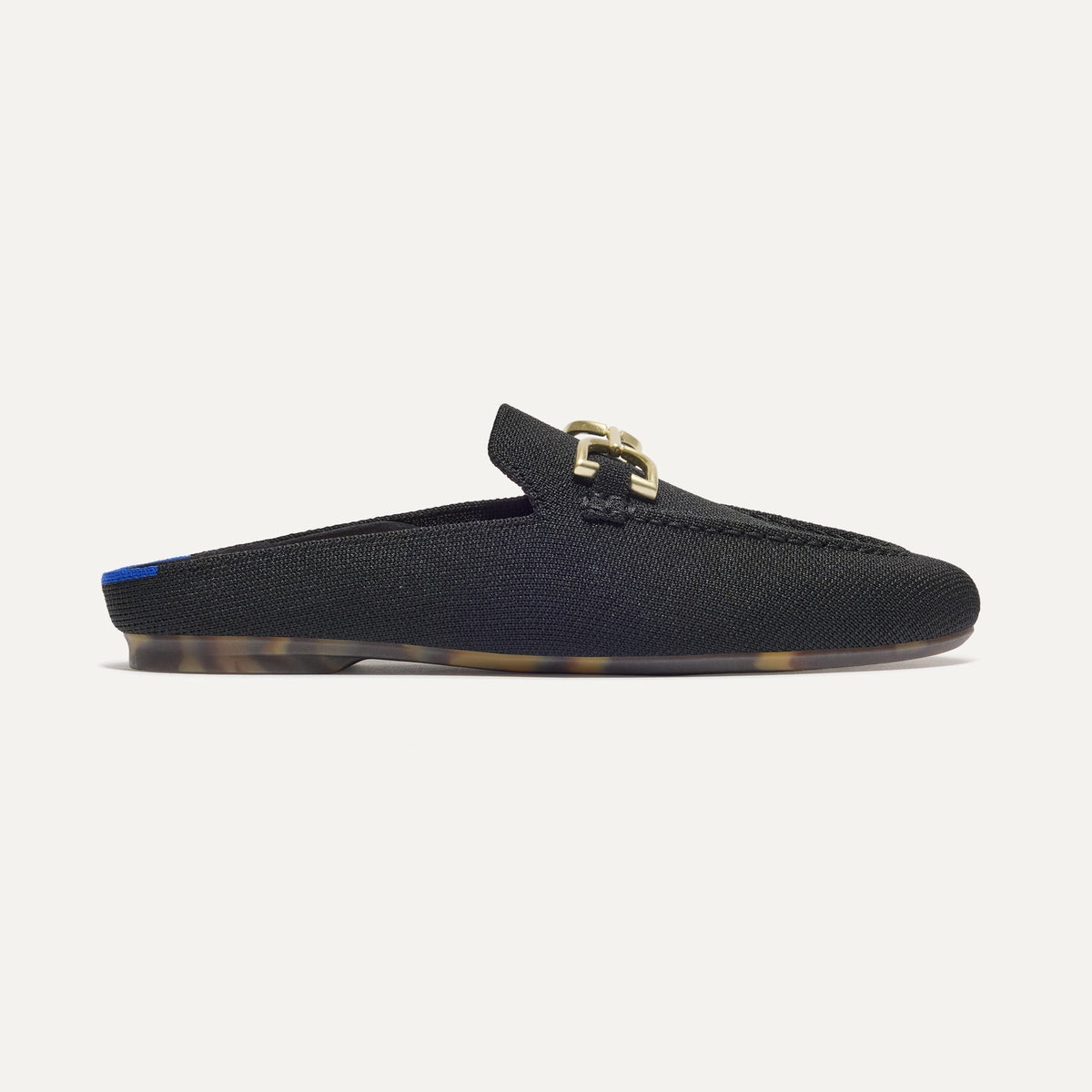 side | The Double Bit Loafer Mule in Black shown from the side.