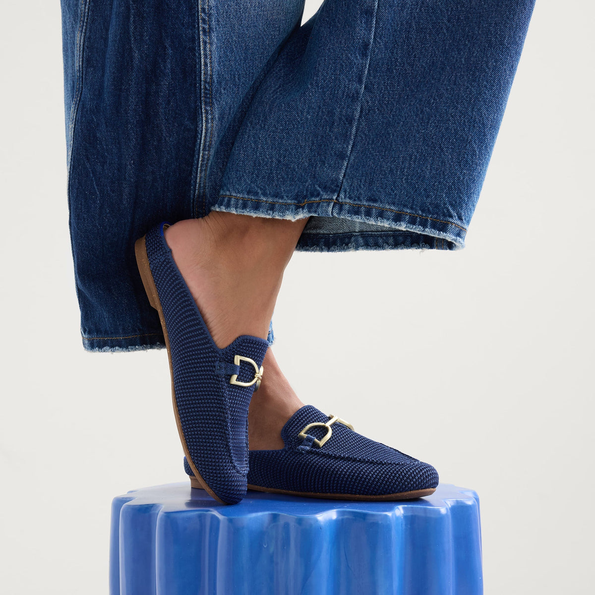 hover | Model wearing The Double Bit Loafer Mule in Blue Raffia-Knit.