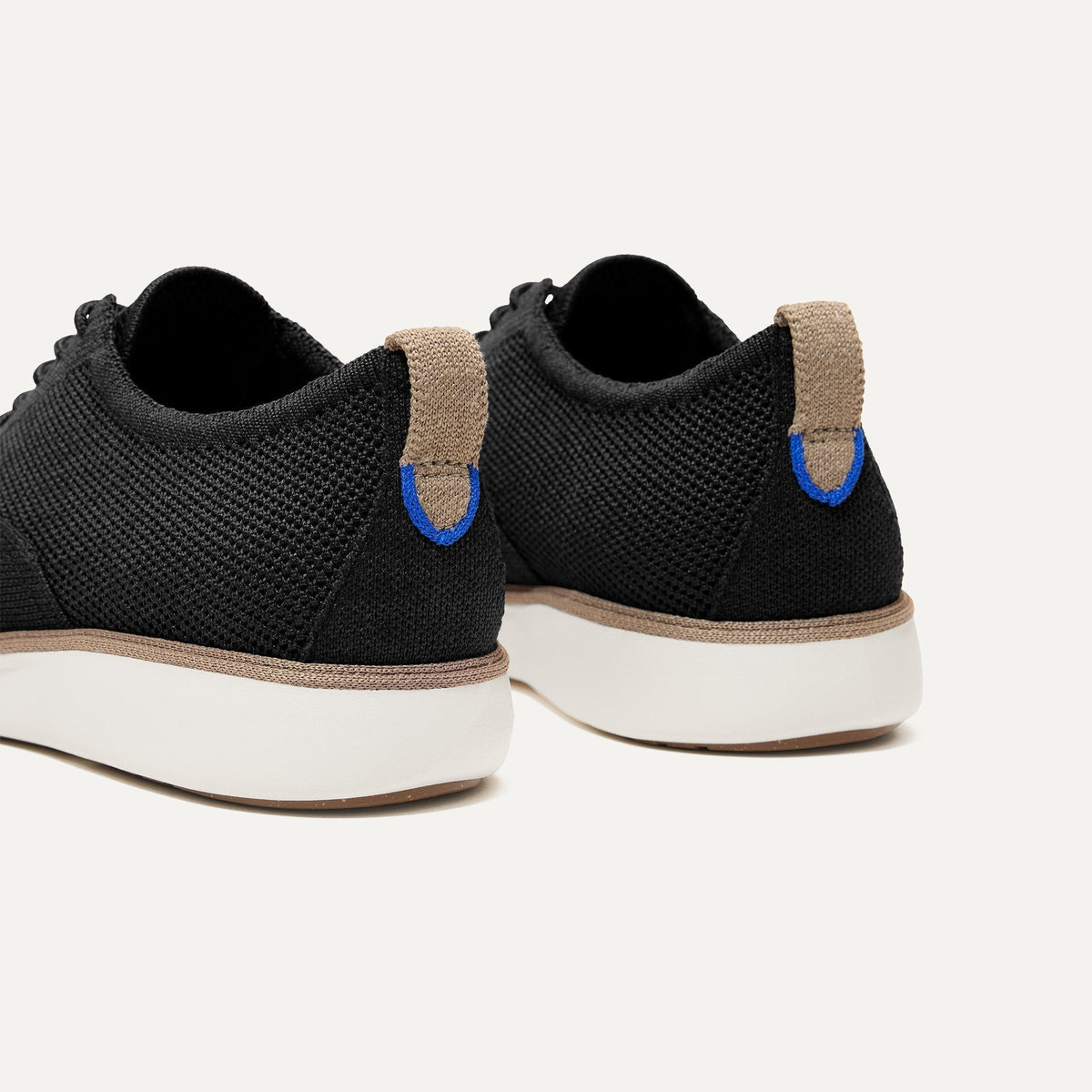 Close up of the heel of The Oxford in Black, with Rothy's signature blue halo.
