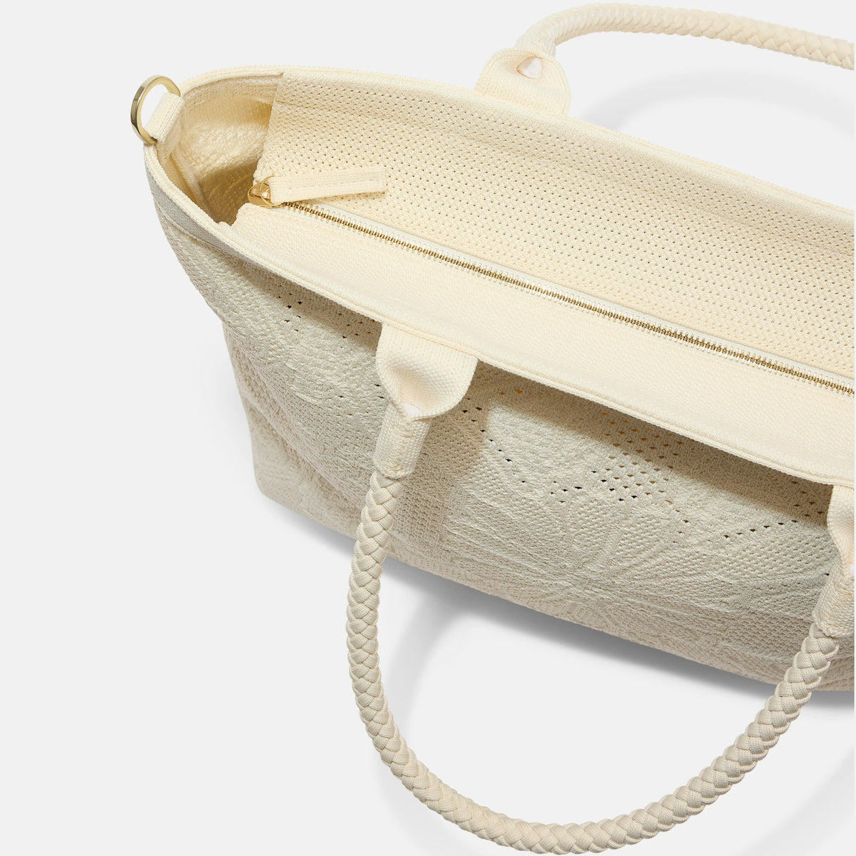 A close up of The Lightweight Zip Tote in Moonflower focusing on the zip closure and handles.