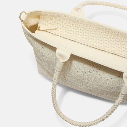 A close up of The Lightweight Zip Tote in Moonflower focusing on the zip closure and handles.