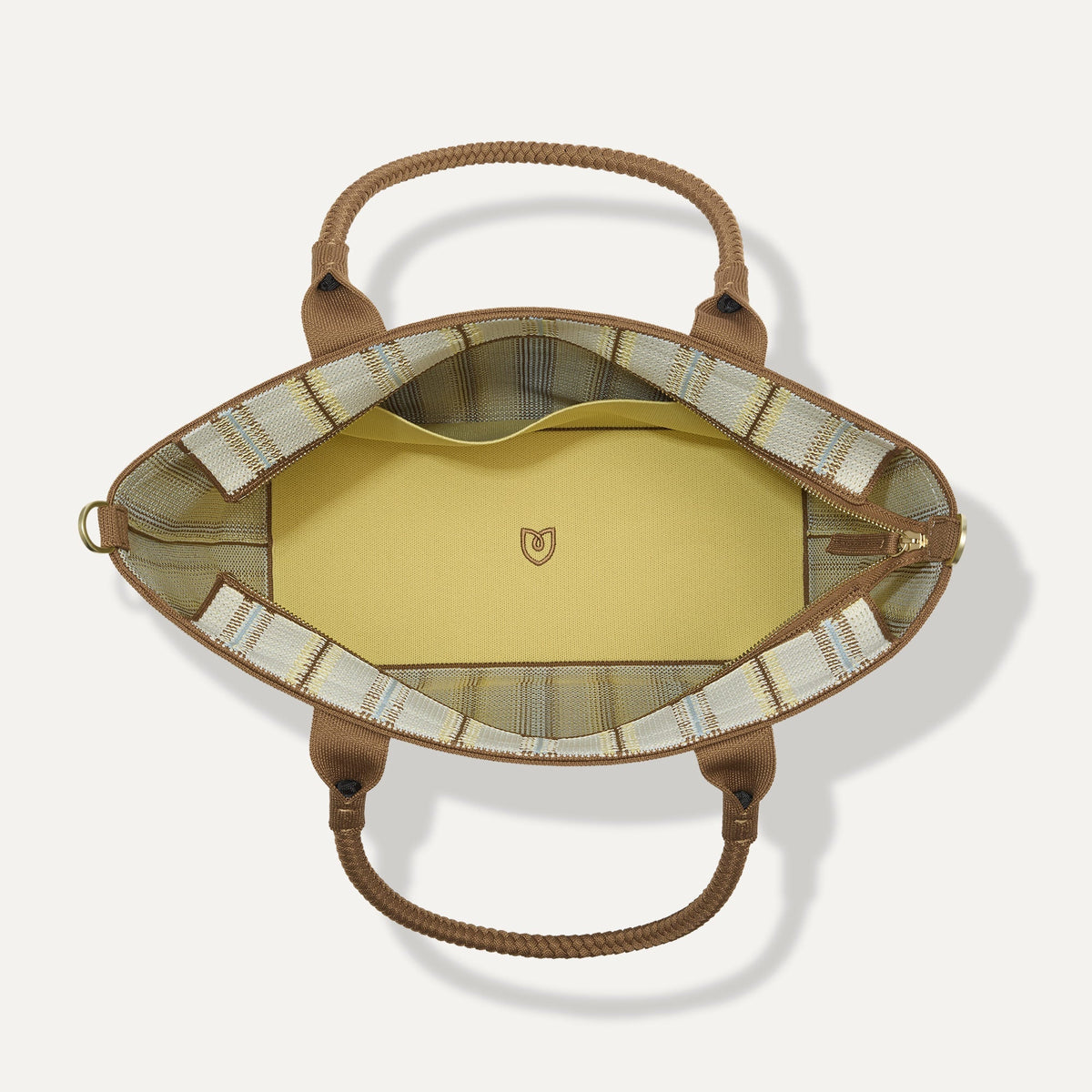 The Lightweight Zip Tote in Sunbeam Market Stripe, shown from above with the interior exposed.