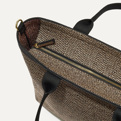 The Lightweight Zip Tote in Cacao Herringbone focusing on the zip closure and handles