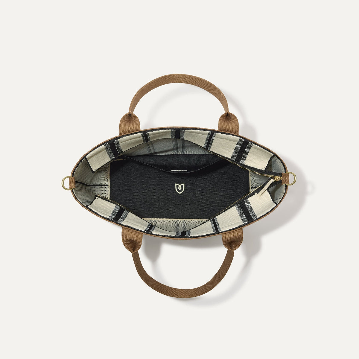 The Lightweight Zip Tote in Coastline, shown from above with the interior exposed.