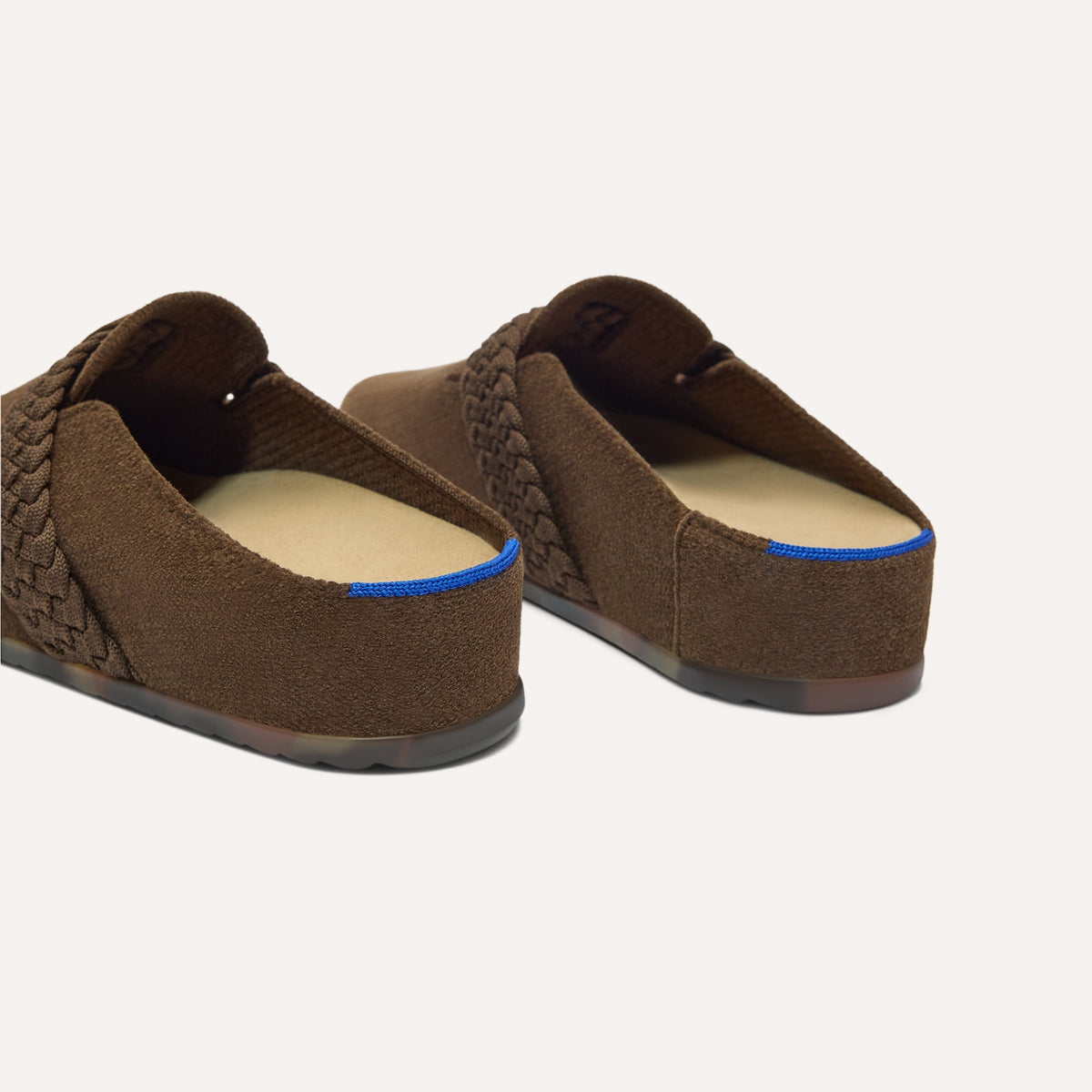 Close up of the heel of The Braid Clog in ReVelvet Bistro, with Rothy's signature blue halo.
