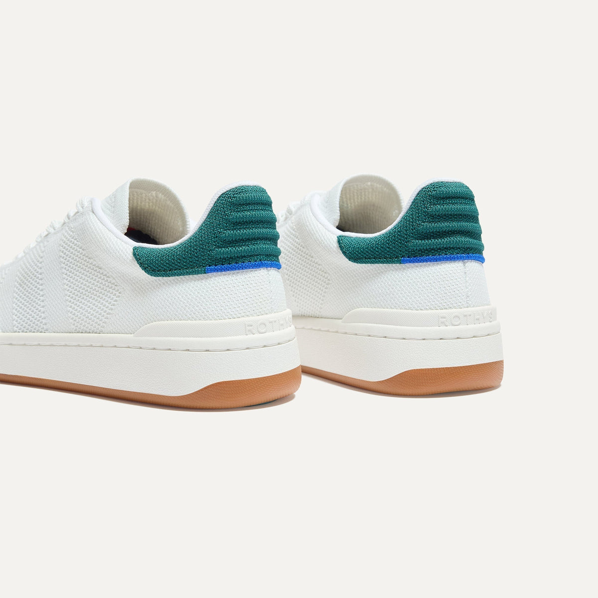 Close up of the heel of The Men's Court Sneaker in Turf, with Rothy's signature blue halo.