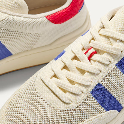 Close up of the toe and stitching details of The Men's Court Sneaker in Turbo Blue.