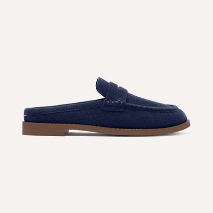side | The Penny Loafer Mule in ReVelvet Navy shown from the side.