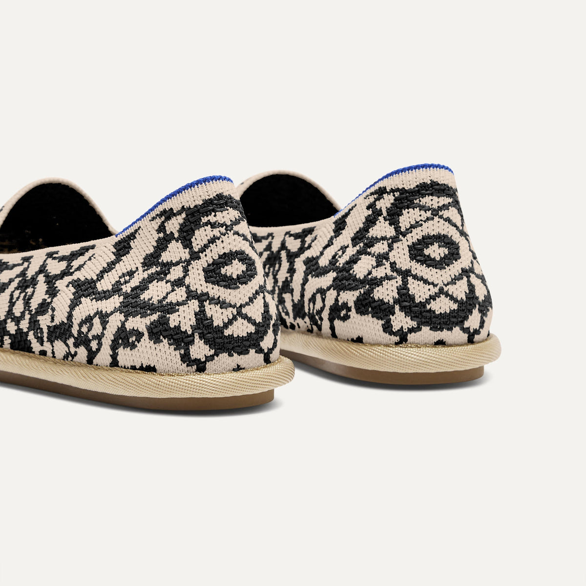 Close up of the heel of The Cruiser Loafer in Espresso Bloom, with Rothy's signature blue halo.