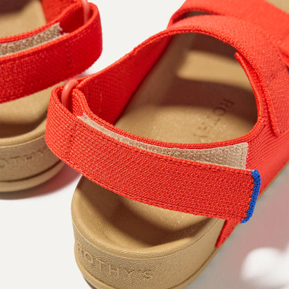 Close up of the velcro heel strap on The Kids Double Strap Sandal in Firetruck Red.