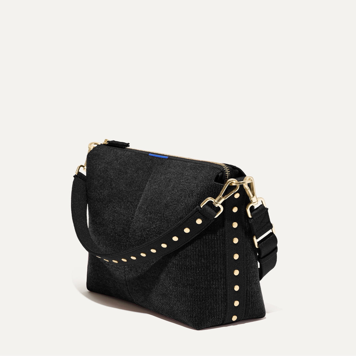 The Daily Crossbody in Revelvet™ Black shown at a diagonal view from the left.