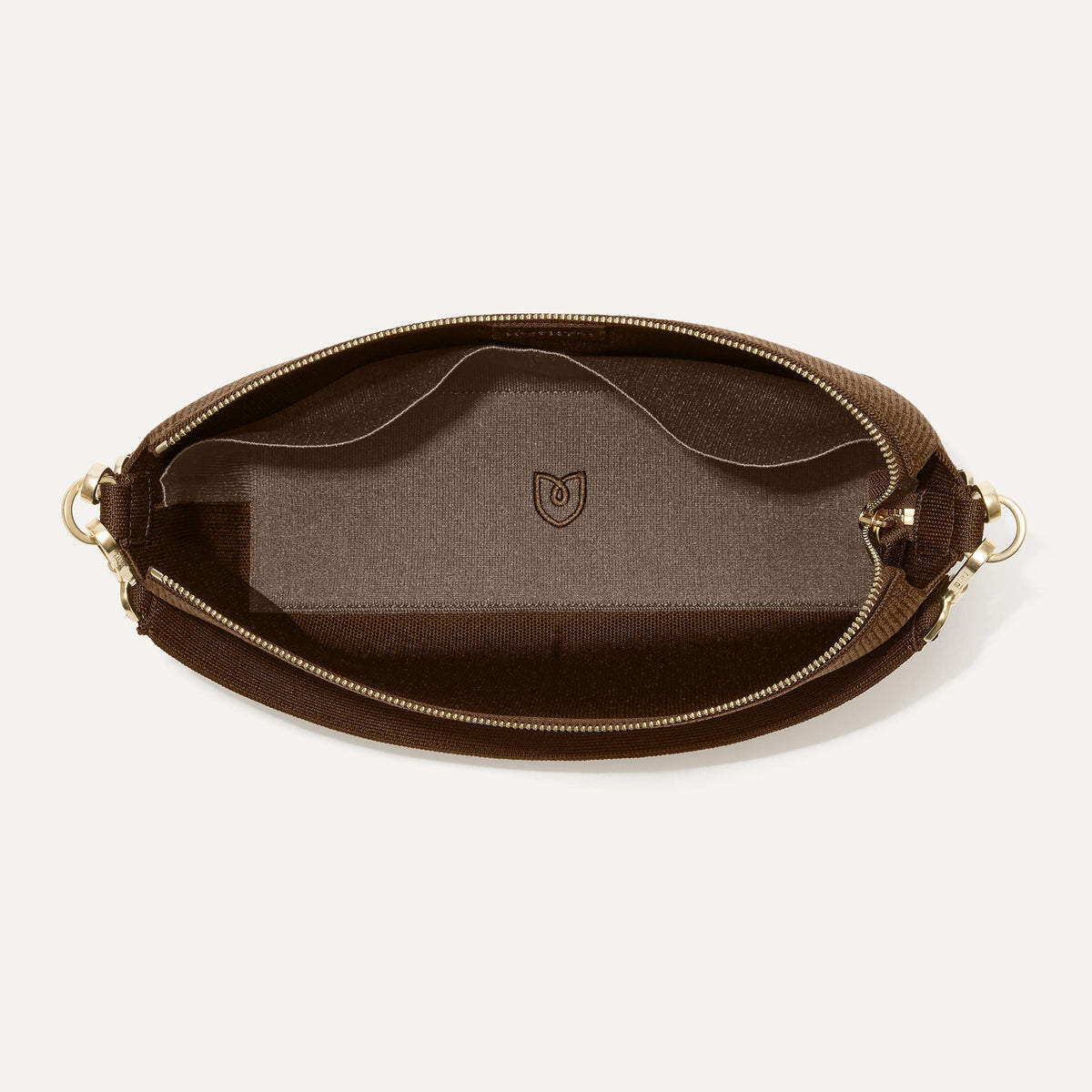 The Daily Crossbody in Revelvet™ Cinnamon shown from the top down, with zipper open and interior exposed.