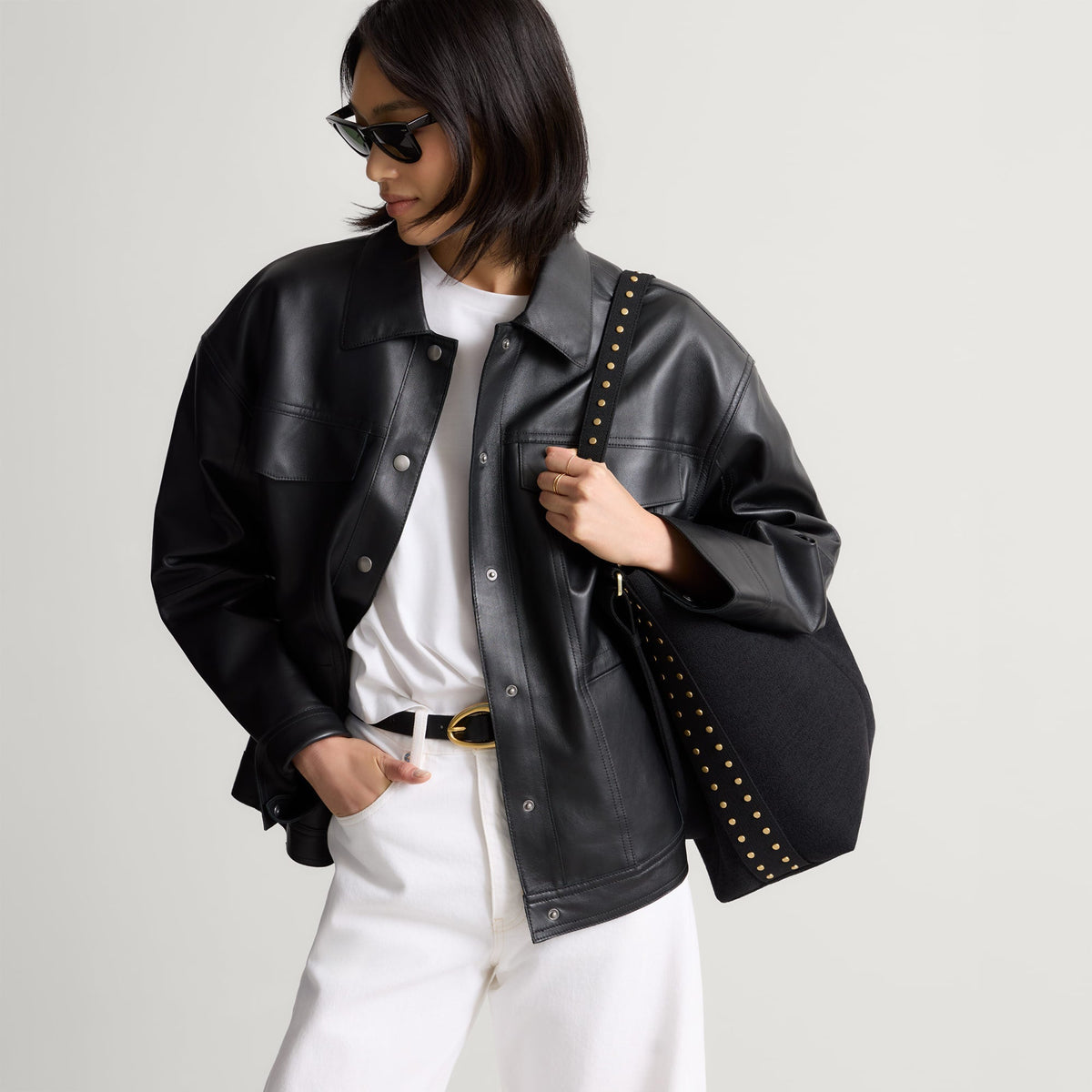 hover | The Bucket Bag in ReVelvet™ Black shown worn differently on model.