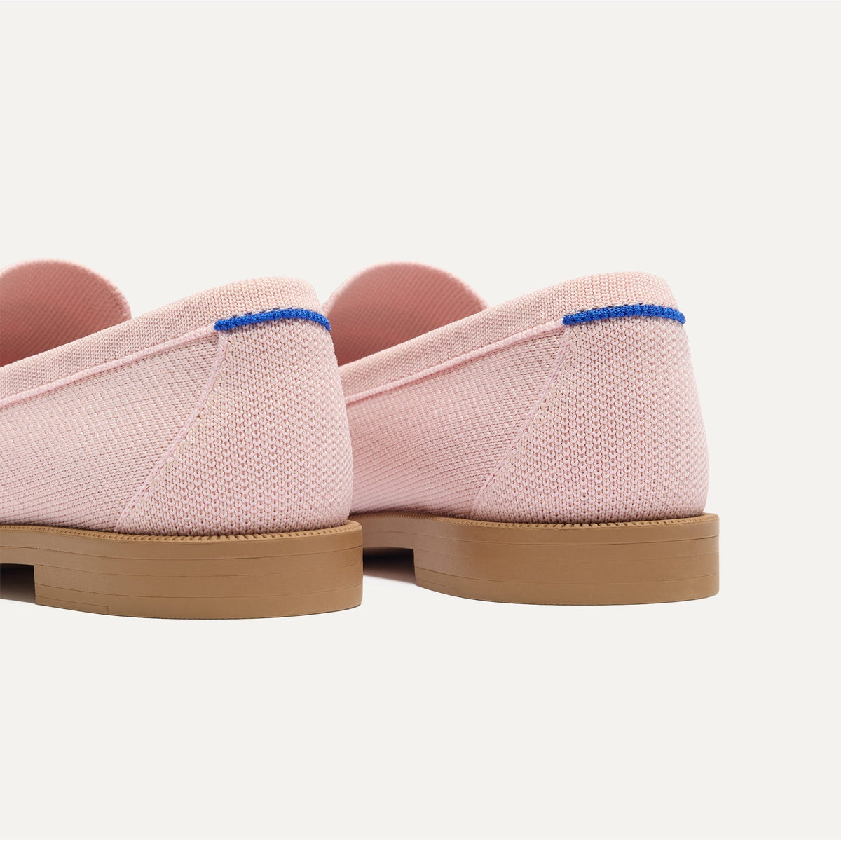 Close up of the heel of The Penny Loafer in Light Pink, with Rothy's signature blue halo.
