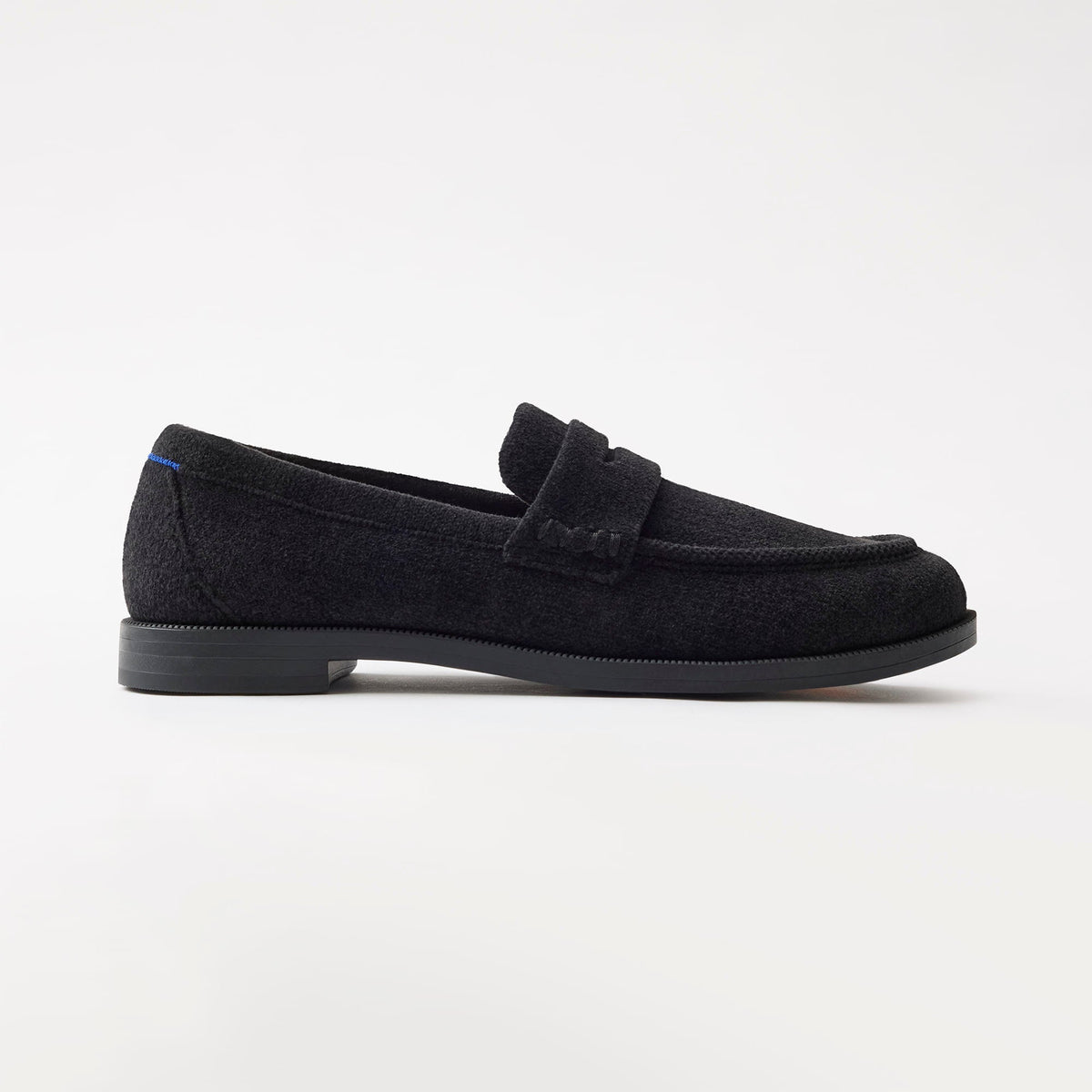 side | The Penny Loafer in ReVelvet Black shown from the side.