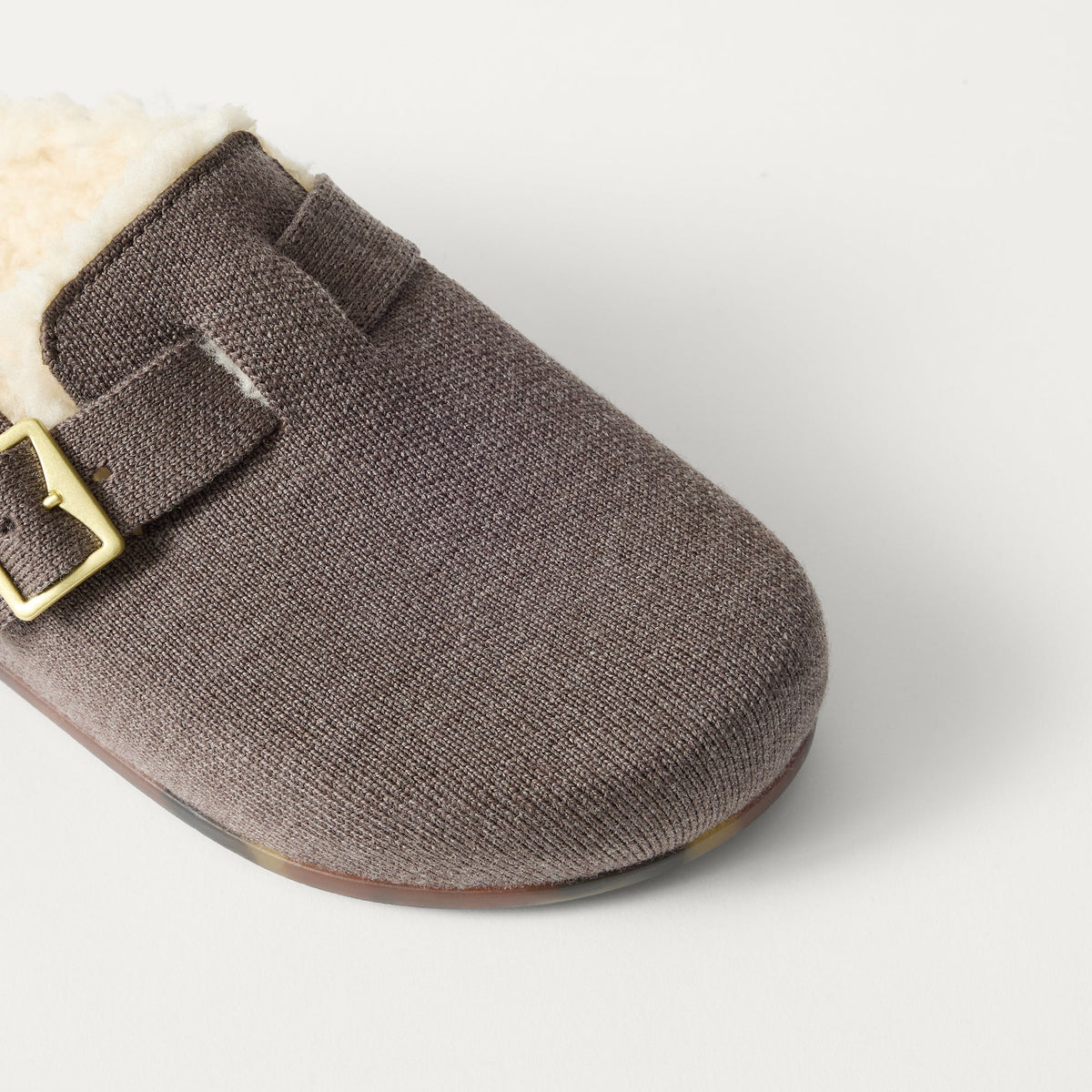 Close up of the buckle detail and vamp of The Teddy Buckle Clog in Porcini.