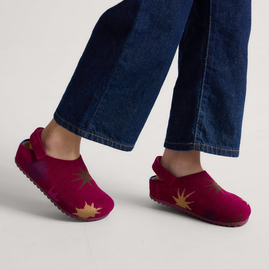 hover | Model wearing The Kids Clog in ReVelvet™ Fuchsia Burst.