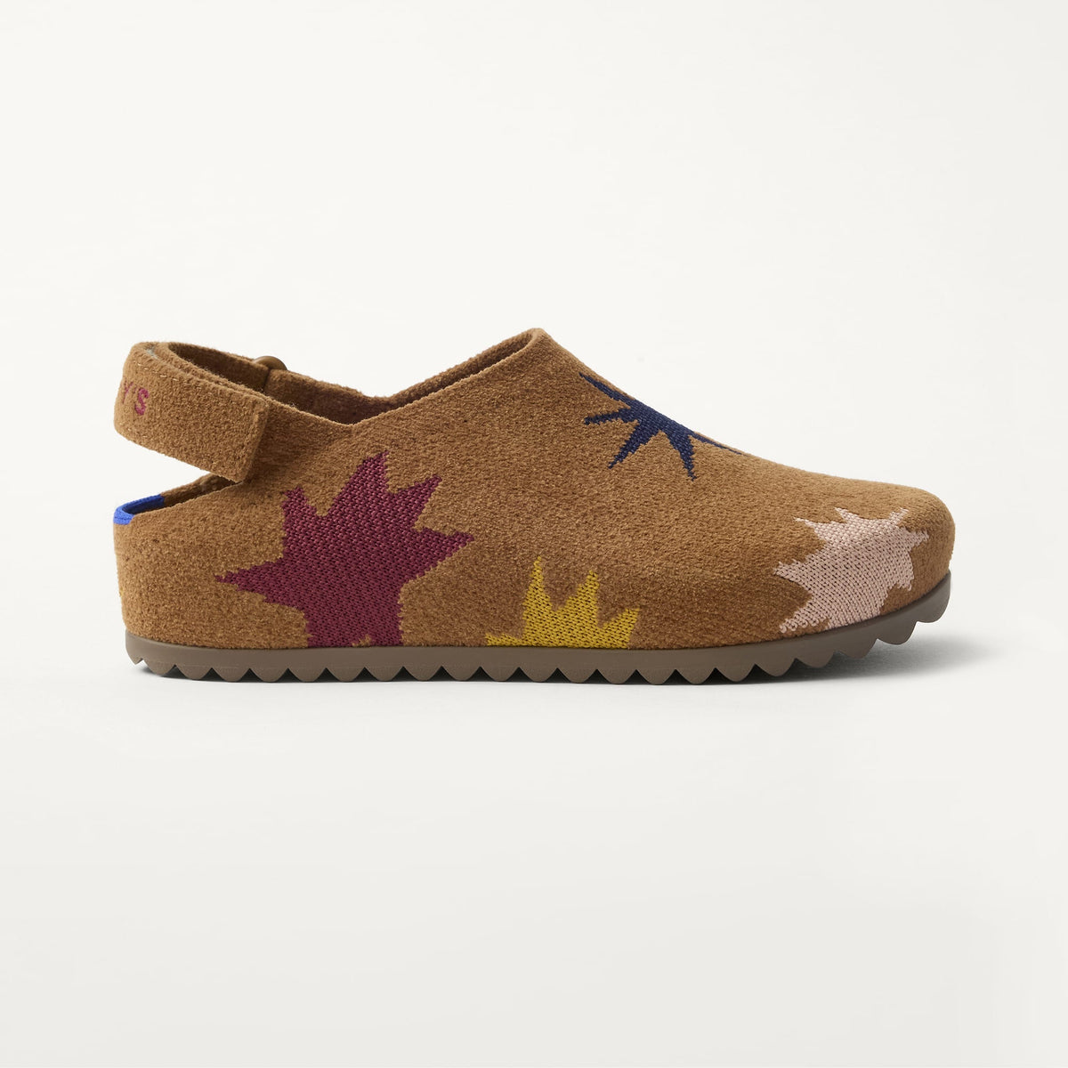 The Kids Clog in ReVelvet™ Butterscotch Burst shown from a side view showing the outsole.