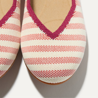 Close up of the toe and vamp of The Daily Flat in Coral Cabana Stripe.