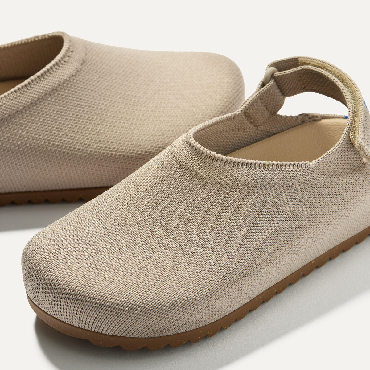 Close up of the rounded topline of The Kids Clog in Dove.