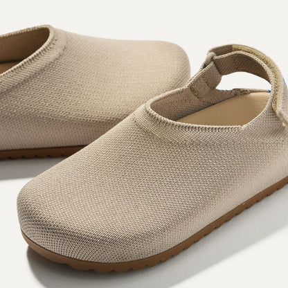 Close up of the rounded topline of The Kids Clog in Dove.