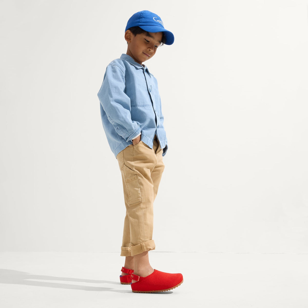 model | Alternate view of a child wearing The Kids Clog in Firetruck Red.