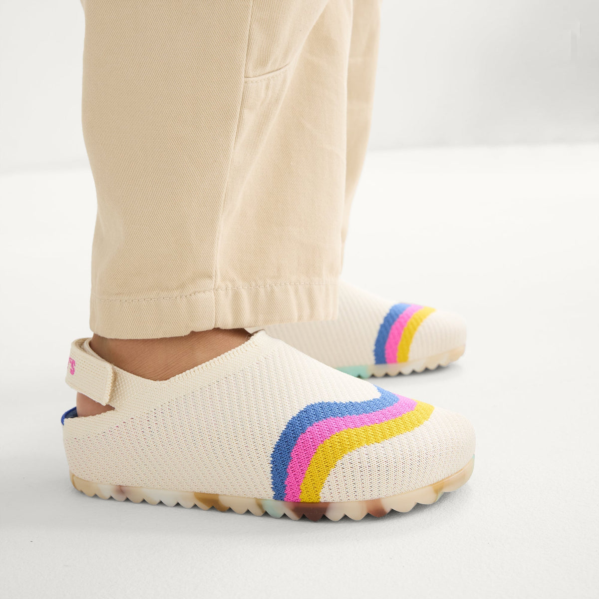 hover | A child wearing The Kids Clog in Retro Wave.