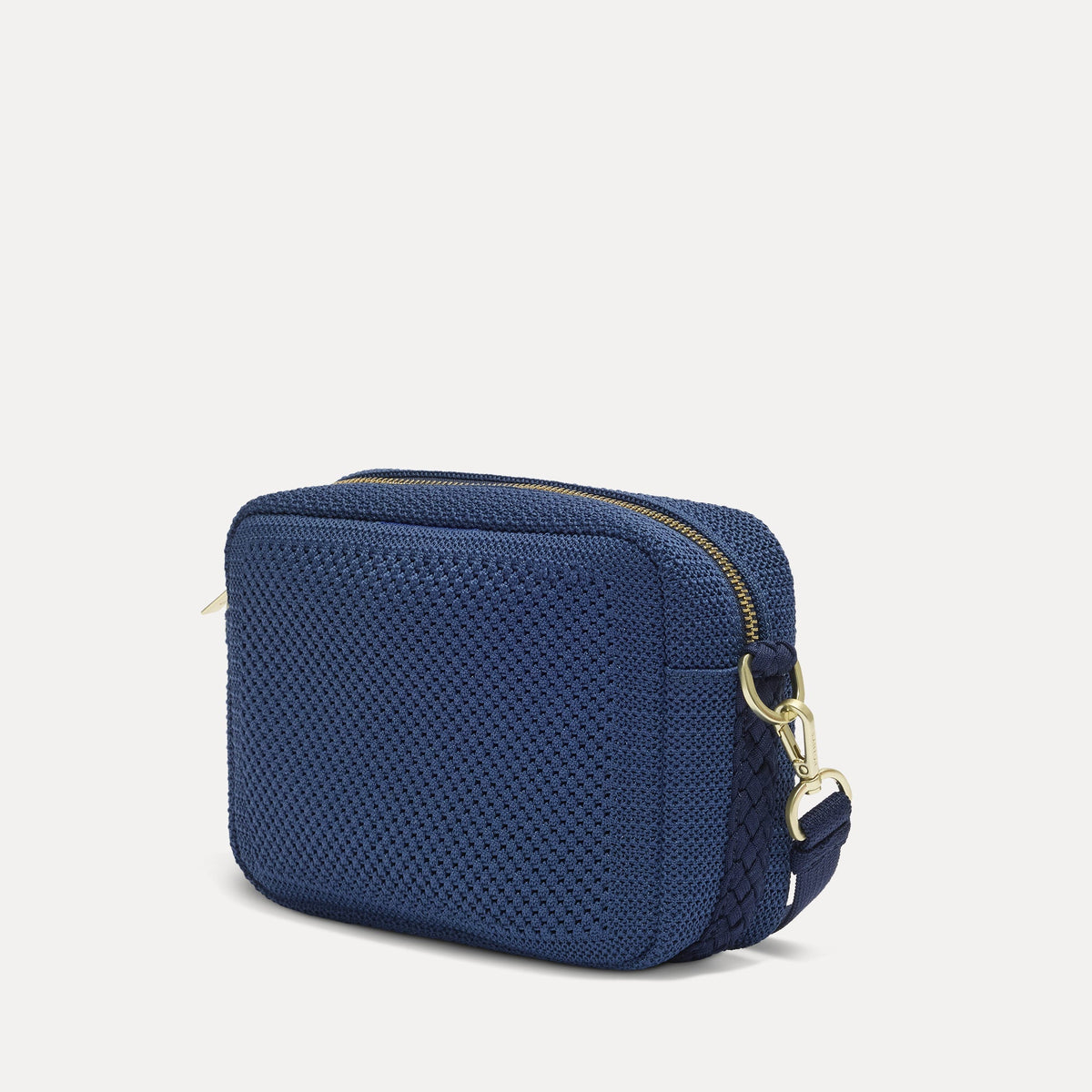 The Crossbody Camera Bag in Lagoon Open-Knit, shown from the side.