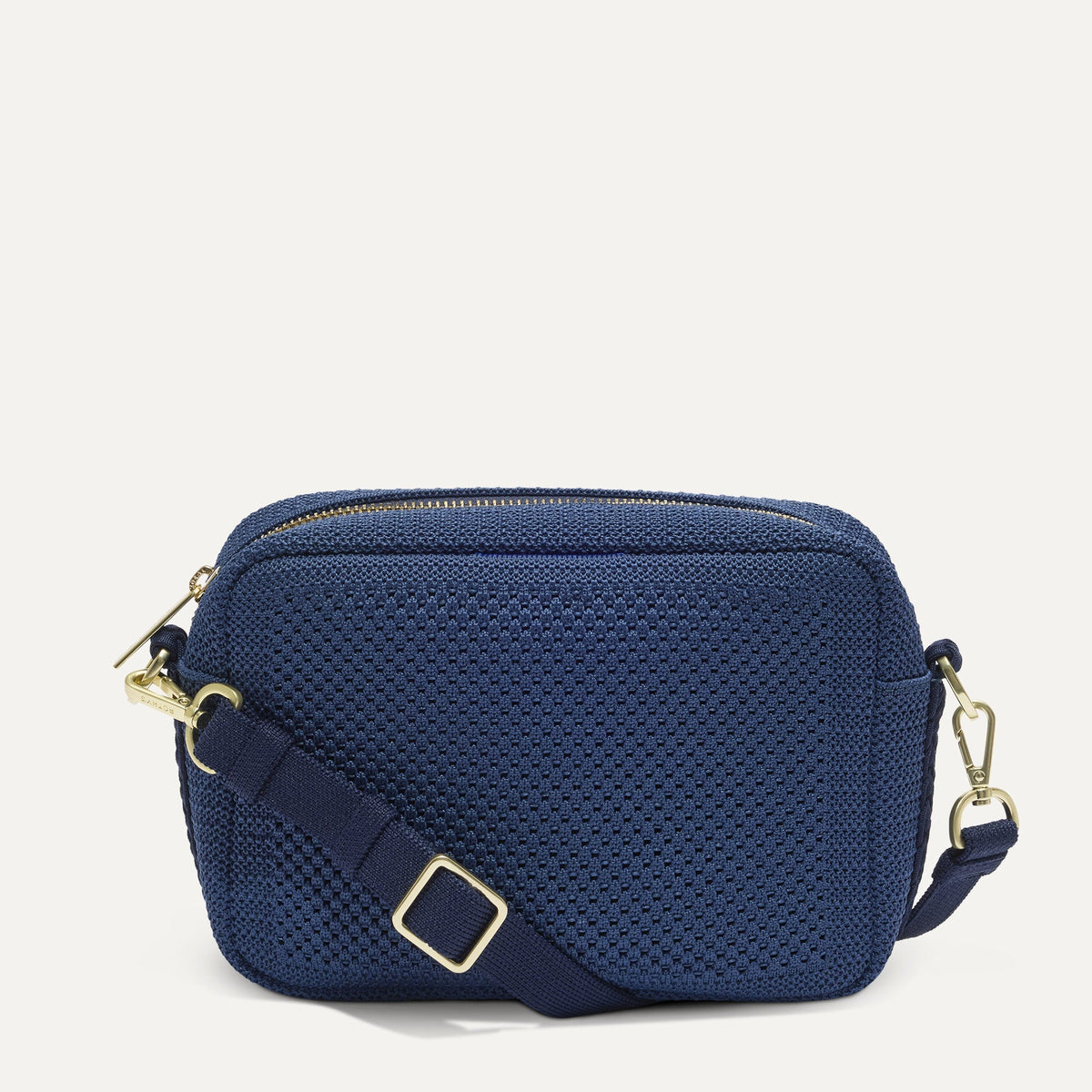 PDP |The Crossbody Camera Bag in Lagoon Open-Knit, shown from the front.