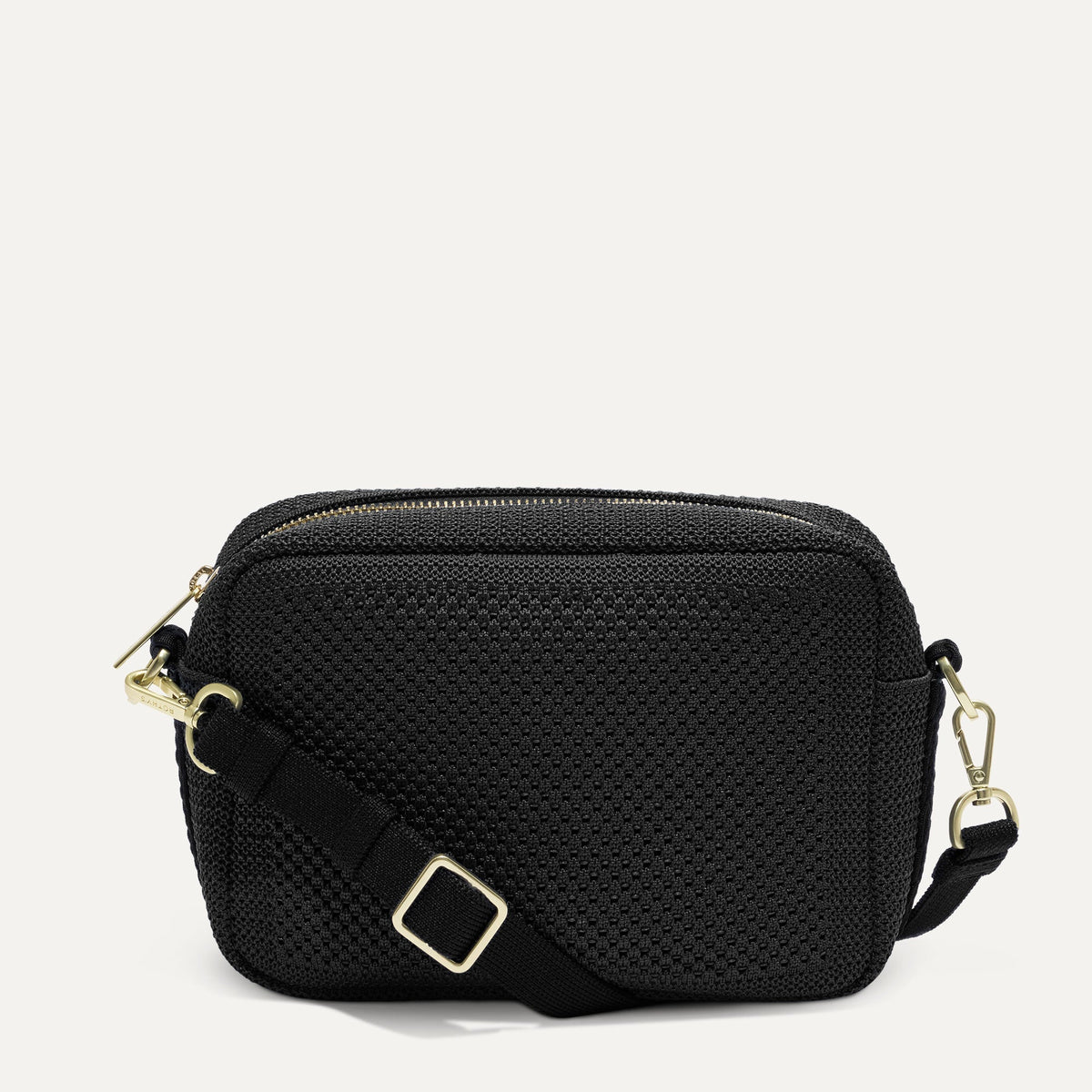PDP |The Crossbody Camera Bag in Black Licorice Open-Knit, shown from the front.