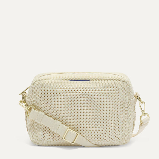 PDP |The Crossbody Camera Bag in Cream Twist Open-Knit, shown from the front.