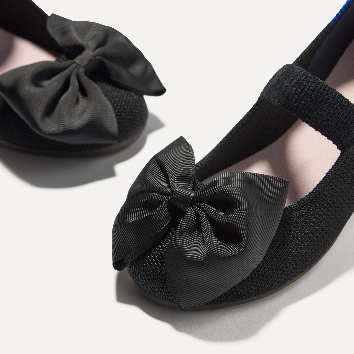 Close up of the bow detail of The Kids Big Bow Mary Jane in Black.