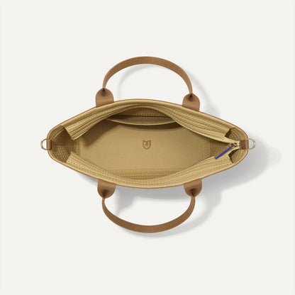 The Lightweight Zip Tote in Brown Butter Crochet, shown from above with the interior exposed.