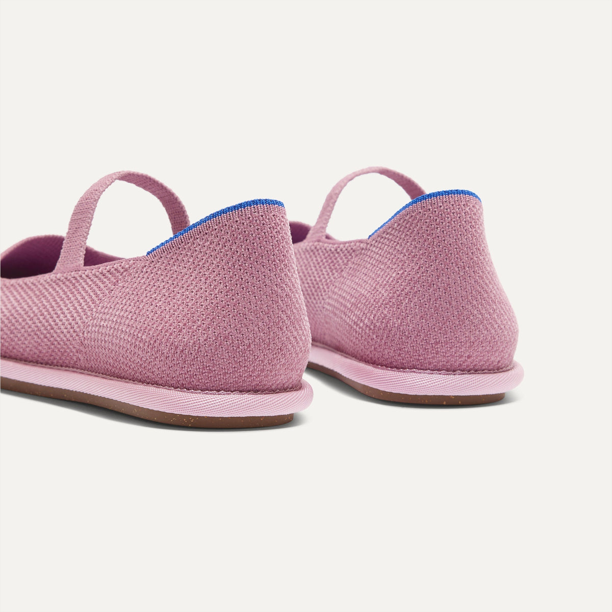 Close up of the heel of The Cruiser Mary Jane in ReVelvet™ Lilac, with Rothy's signature blue halo.