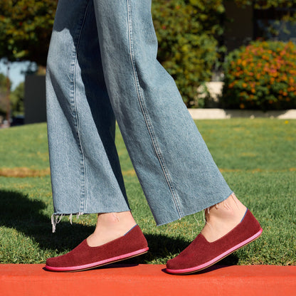 Another view of a model wearing The Cruiser Loafer in ReVelvet Cabernet.